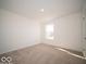 Neutral carpeted bedroom featuring a bright window at 1585 Hanover St, Danville, IN 46122