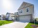 Beautiful two-story home with a spacious two-car garage and green lawn at 1585 Hanover St, Danville, IN 46122