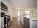 Contemporary kitchen with stainless appliances, a large island, and a view of the backyard at 1585 Hanover St, Danville, IN 46122