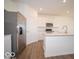 Bright kitchen with stainless steel appliances, white cabinets and a spacious island at 1585 Hanover St, Danville, IN 46122
