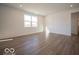 Spacious living room with hardwood floors and plenty of natural light at 1585 Hanover St, Danville, IN 46122