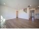 Open-concept living room with light wood floors and neutral paint, offering a bright and airy feel at 1585 Hanover St, Danville, IN 46122