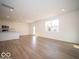 Open-concept living space with modern finishes and stainless steel appliances at 1585 Hanover St, Danville, IN 46122
