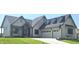 Charming single-Gathering home with a manicured lawn, two-car garage and inviting front entry at 16298 Grand Cypress Dr, Noblesville, IN 46060