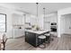 Well-designed kitchen with an island, stylish pendant lighting, and modern appliances at 17366 Newton Main St, Westfield, IN 46074