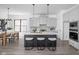 Modern kitchen with an island, sleek stools, and open access to the dining area at 17366 Newton Main St, Westfield, IN 46074