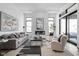 Bright living room boasts fireplace, plush seating, and sleek modern finishes at 17366 Newton Main St, Westfield, IN 46074