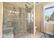 Modern bathroom with a glass-enclosed shower and a window with natural light at 2227 Hidden Orchard Ct, Indianapolis, IN 46228