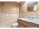 Bathroom with marble countertops, gold fixtures, a vanity, and a mirror at 2227 Hidden Orchard Ct, Indianapolis, IN 46228