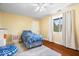 Bright bedroom with a bed, overhead fan and a window with curtains at 2227 Hidden Orchard Ct, Indianapolis, IN 46228