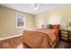 Comfortable bedroom with hardwood floors, ceiling fan, and cozy rug at 2227 Hidden Orchard Ct, Indianapolis, IN 46228