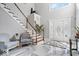 Bright foyer with a staircase, marble floors, and a decorative front door at 2227 Hidden Orchard Ct, Indianapolis, IN 46228