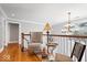 Upstairs hallway with hardwood floors, white railings, and a chandelier at 2227 Hidden Orchard Ct, Indianapolis, IN 46228