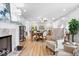 Open-concept living space with a fireplace, dining area, and comfortable seating at 2227 Hidden Orchard Ct, Indianapolis, IN 46228