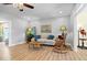 Comfortable living room with neutral tones, a sofa, and a rocking chair at 2227 Hidden Orchard Ct, Indianapolis, IN 46228