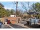 Outdoor brick kitchen and patio with seating area, perfect for entertaining guests at 2227 Hidden Orchard Ct, Indianapolis, IN 46228
