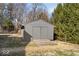 Backyard includes a storage shed with painted wood siding and a double-door entry at 2227 Hidden Orchard Ct, Indianapolis, IN 46228
