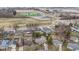 This home features an aerial view of a suburban neighborhood with sports complex and other amenities at 1024 N Michigan St, Greenfield, IN 46140