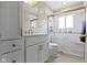 Bright bathroom featuring a walk-in shower with glass doors, and white cabinets at 1024 N Michigan St, Greenfield, IN 46140