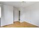 Bedroom featuring a ceiling fan, closet with sliding doors, and parquet flooring at 1024 N Michigan St, Greenfield, IN 46140