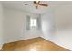This bedroom features natural light, parquet flooring and a ceiling fan at 1024 N Michigan St, Greenfield, IN 46140
