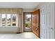 Inviting entryway featuring a large window, bright lighting, and a beautiful wood door at 1024 N Michigan St, Greenfield, IN 46140
