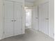 Hallway featuring several storage and closet doors with views into other rooms at 1024 N Michigan St, Greenfield, IN 46140
