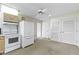 This kitchen features neutral cabinets, a white refrigerator and a ceiling fan at 1024 N Michigan St, Greenfield, IN 46140