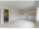 Bright living room with built-in shelving, carpet, and natural lighting from the window at 1024 N Michigan St, Greenfield, IN 46140
