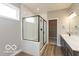 Modern bathroom features a glass shower and double sink vanity at 15468 Streamwood Dr, Fishers, IN 46037
