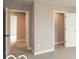 Carpeted bedroom with two open doors and neutral walls at 15468 Streamwood Dr, Fishers, IN 46037