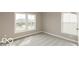 Bedroom with two windows and neutral carpet, paint, and trim at 15468 Streamwood Dr, Fishers, IN 46037