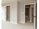 Carpeted bedroom with two open doors and neutral walls at 15468 Streamwood Dr, Fishers, IN 46037