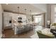 Bright, open kitchen with a large center island, stainless steel appliances, and a view into the dining area at 15468 Streamwood Dr, Fishers, IN 46037