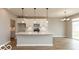 Modern kitchen featuring white cabinets, stainless steel appliances, a large island with pendant lighting at 15468 Streamwood Dr, Fishers, IN 46037