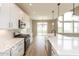 Bright kitchen with white cabinets, stainless steel appliances, and a large island with seating at 15468 Streamwood Dr, Fishers, IN 46037
