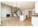 Spacious living room with a fireplace and open floor plan at 15468 Streamwood Dr, Fishers, IN 46037