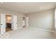 Bright primary bedroom with view of the bathroom and closet at 15468 Streamwood Dr, Fishers, IN 46037