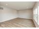 Spacious bedroom featuring hardwood floors, recessed lighting, and large windows at 1019 Cyprian Way, Lebanon, IN 46052