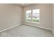 Cozy bedroom with soft carpet, neutral walls, and double windows providing natural light at 1019 Cyprian Way, Lebanon, IN 46052