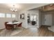 Charming dining area with modern table and chairs, seamlessly connecting to a bright and functional home office space at 1019 Cyprian Way, Lebanon, IN 46052