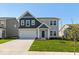 Charming two-story home with a manicured lawn, attached two car garage and inviting front entrance at 1019 Cyprian Way, Lebanon, IN 46052