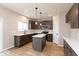 Modern kitchen featuring stainless steel appliances, gray cabinets, an island and hardwood floors at 1019 Cyprian Way, Lebanon, IN 46052