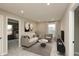 Cozy living room featuring a modern sofa, accent chair, and stylish decor, creating a relaxing atmosphere at 1019 Cyprian Way, Lebanon, IN 46052
