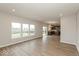 Bright living area with expansive windows and an open layout to a modern kitchen at 1019 Cyprian Way, Lebanon, IN 46052