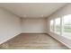Bright living area with hardwood floors, recessed lighting, and large windows at 1019 Cyprian Way, Lebanon, IN 46052