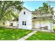 Light blue two-story house with a front porch and yard at 107 White St, Shirley, IN 47384