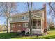 Two-story house with brick and siding exterior, screened porch, and landscaped yard at 11116 Knightsbridge Ln, Fishers, IN 46037