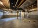 Unfinished basement with concrete walls, exposed ductwork, and small windows at 12023 Crestwater Ct, Fishers, IN 46037