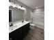 Bathroom featuring a double vanity, tile floor, and a bathtub and shower combination at 12023 Crestwater Ct, Fishers, IN 46037